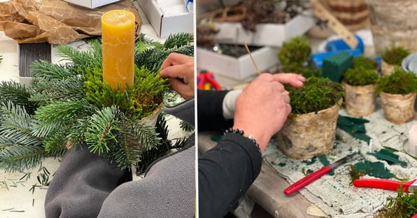 Mitarbeiterinnen beim Adventskränze erstellen für den Weihnachtsmarkt.